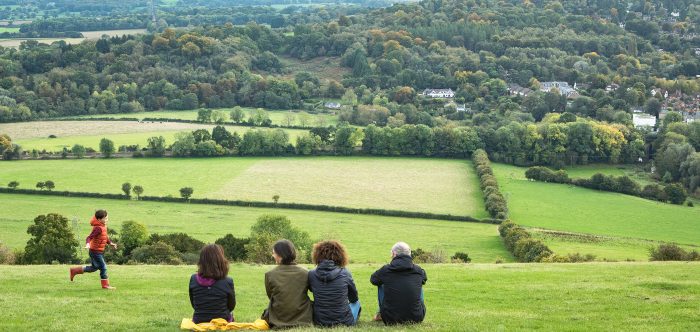 Photo of a family looking over the Surrey Countryside