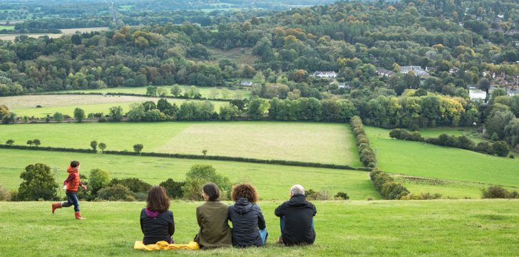 Photo of a family looking over the Surrey Countryside