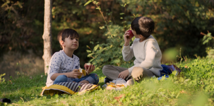 Children having a lunch in the countryside