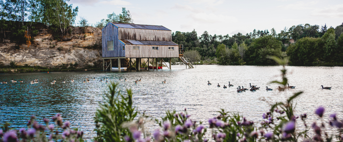 View of Buckland Park lake with a Hut on stilts over the water