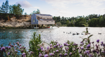 View of Buckland Park lake with a Hut on stilts over the water