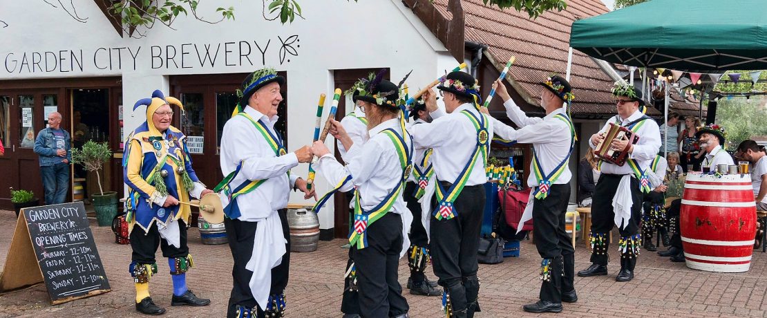 Morris men perform in full regalia