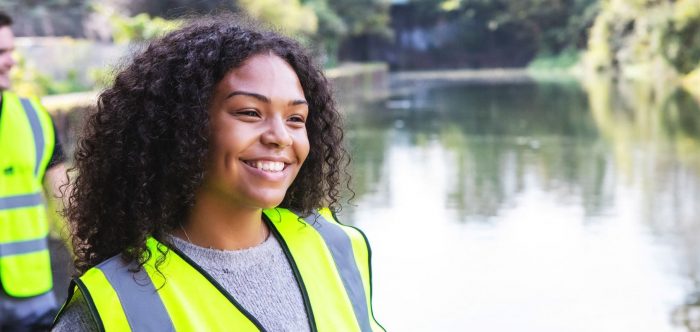 A young woman in a high vis jacket