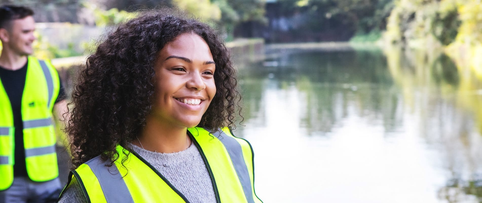A young woman in a high vis jacket