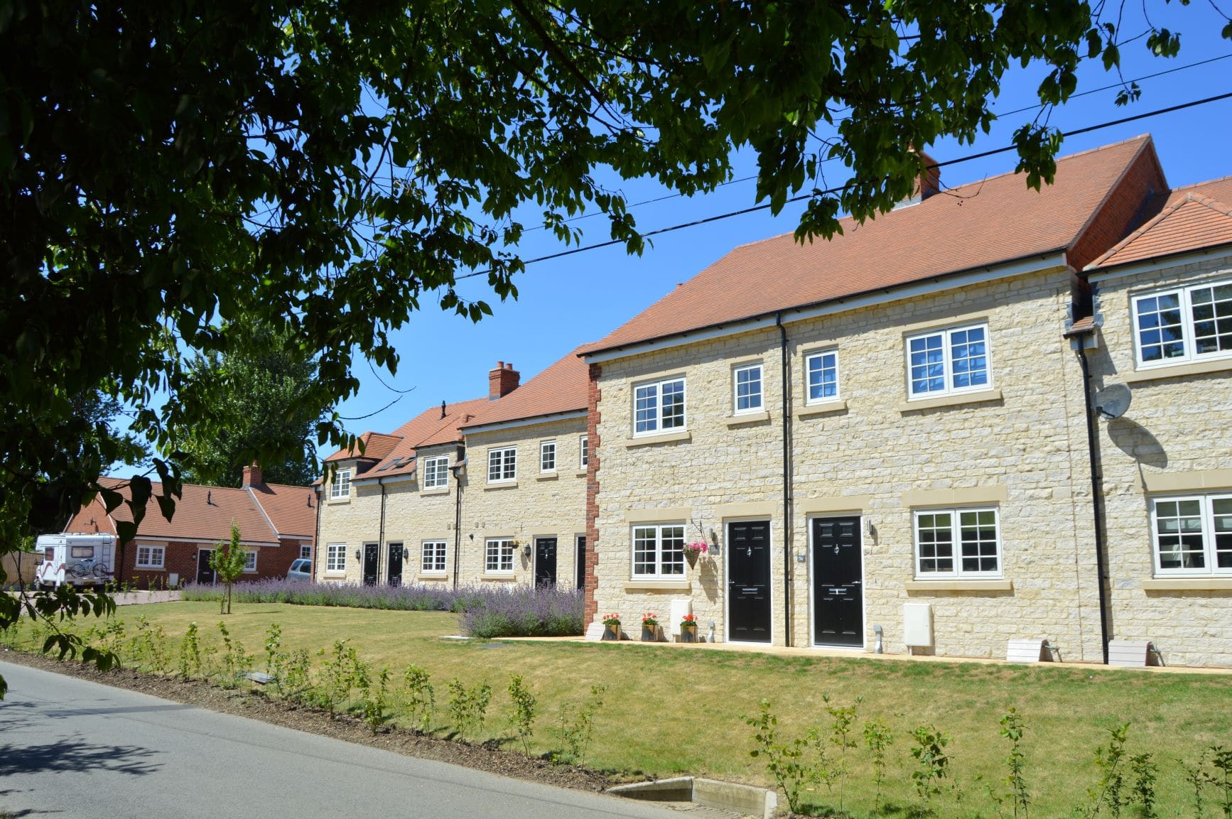 A row of limestone new-build cottages