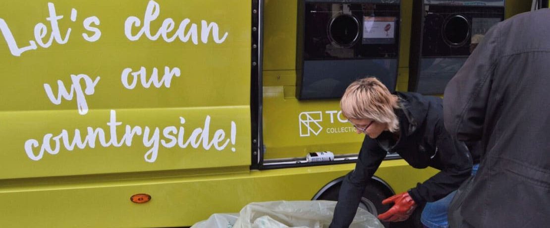 A volunteer trying out CPRE's portable reverse vending machine