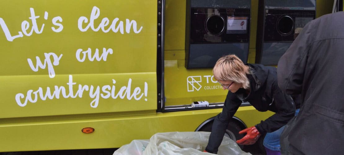 A volunteer trying out CPRE's portable reverse vending machine