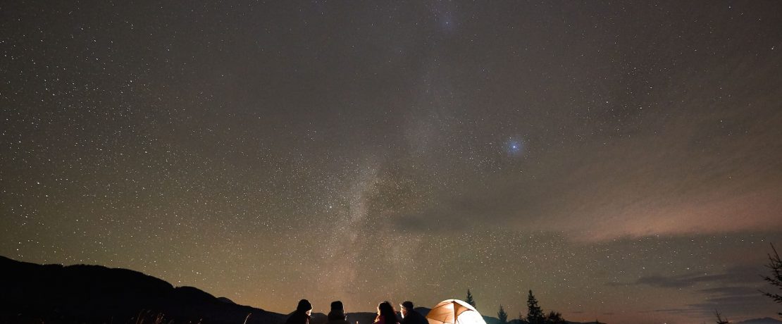 Camping under a starry night sky