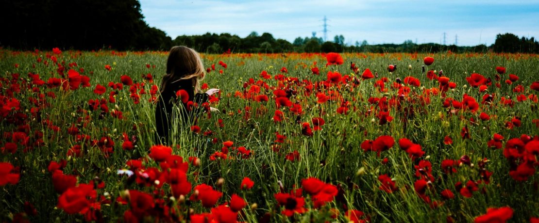 Girl in field of poppies