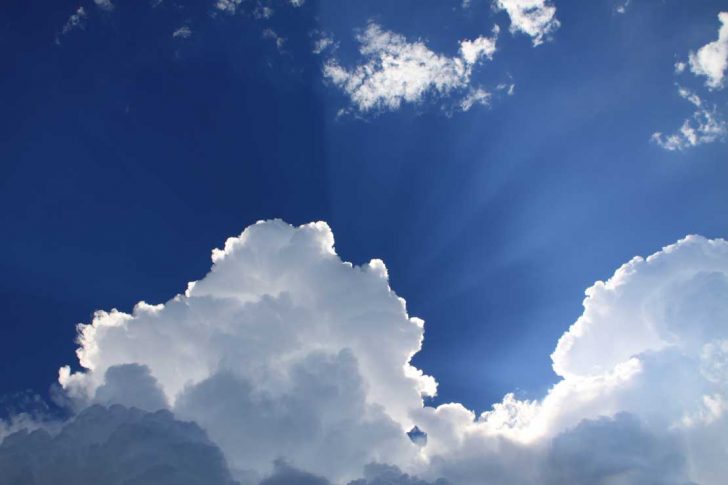 Blue sky with white clouds in front