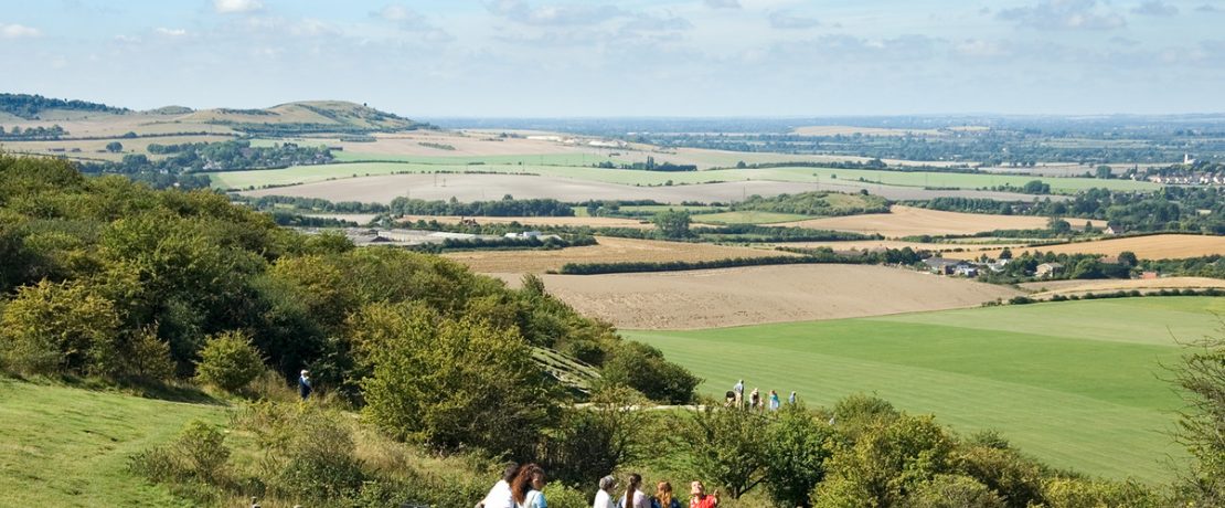 People admiring the view from Ivinghoe Beacon