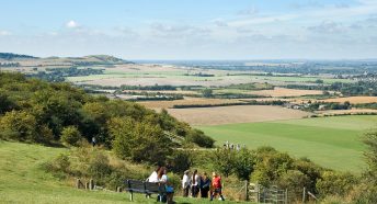 People admiring the view from Ivinghoe Beacon