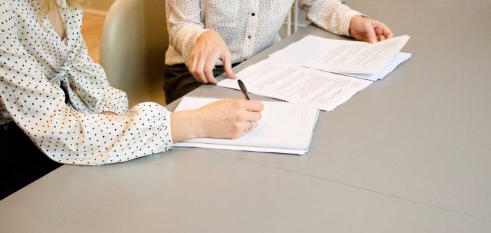 Women looking at documents in an office setting