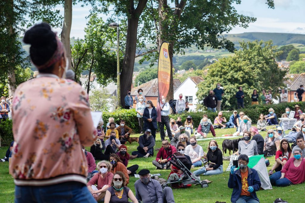 Black Lives Matter gathering listening to woman speaker