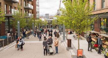 View of people shopping and chatting in newly developed area of a city