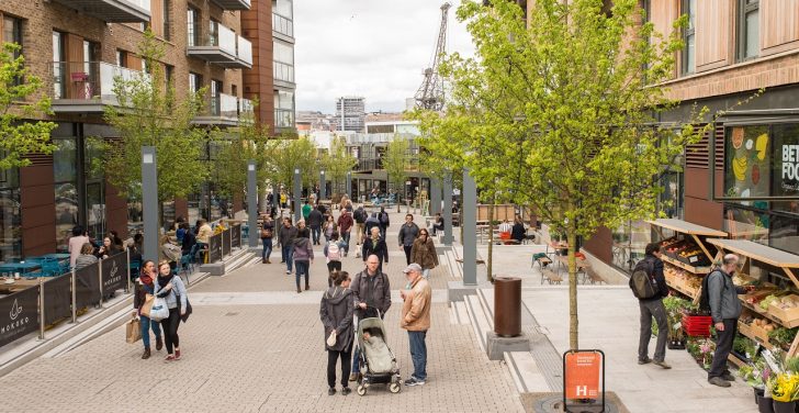 View of people shopping and chatting in newly developed area of a city