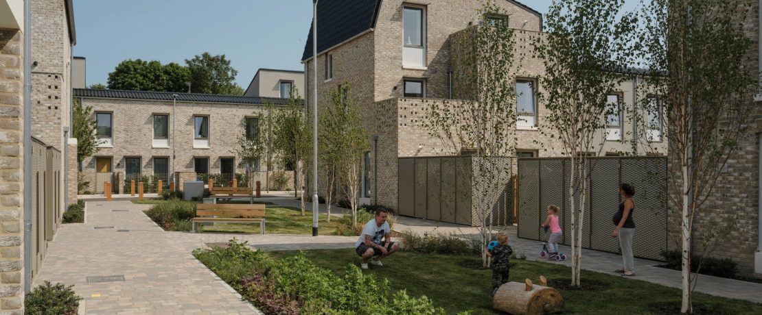 View of children playing out in a modern housing development