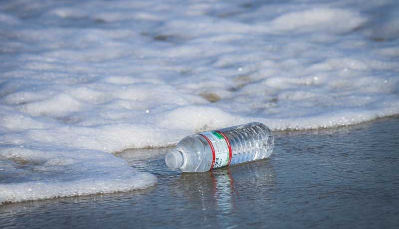 Plastic bottle washed up at sea