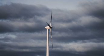 A wind turbine against a cloudy sky