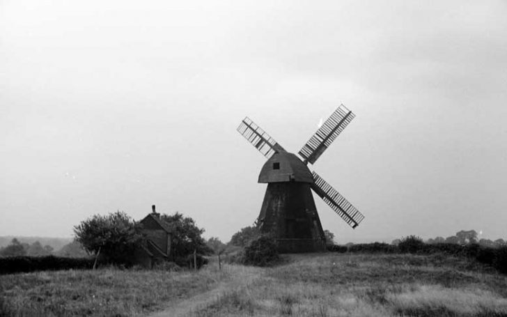 A black and white photograph of a windmill