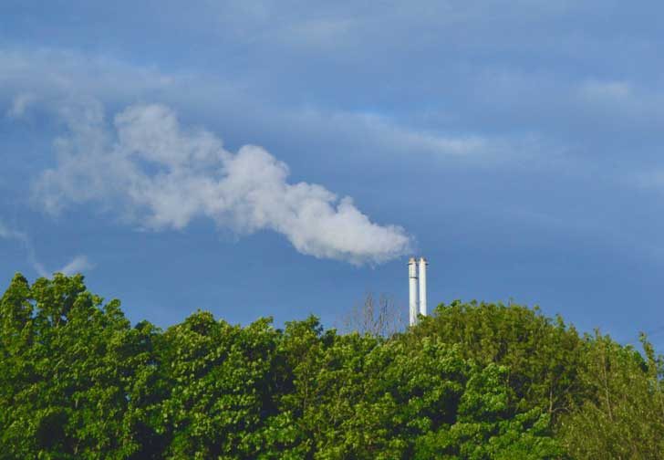 Chimney stacks releasing clouds