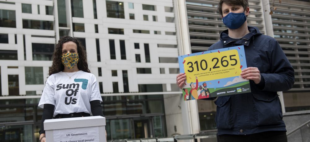 Two people presenting petition