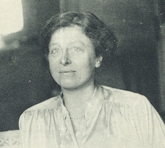 A black and white headshot of a woman