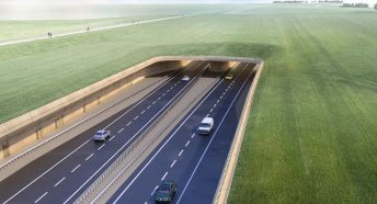 A visualisation of a large road and tunnel through a green landscape