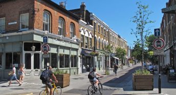 Cyclists and walkers in a quiet urban street