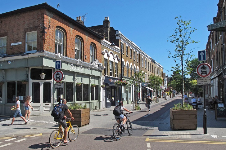 Cyclists and walkers in a quiet urban street