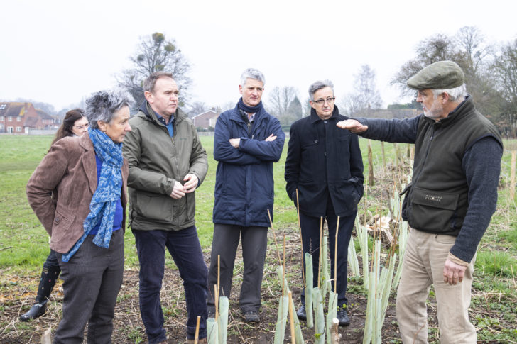 George Eustice taking part in a hedgerow planting session