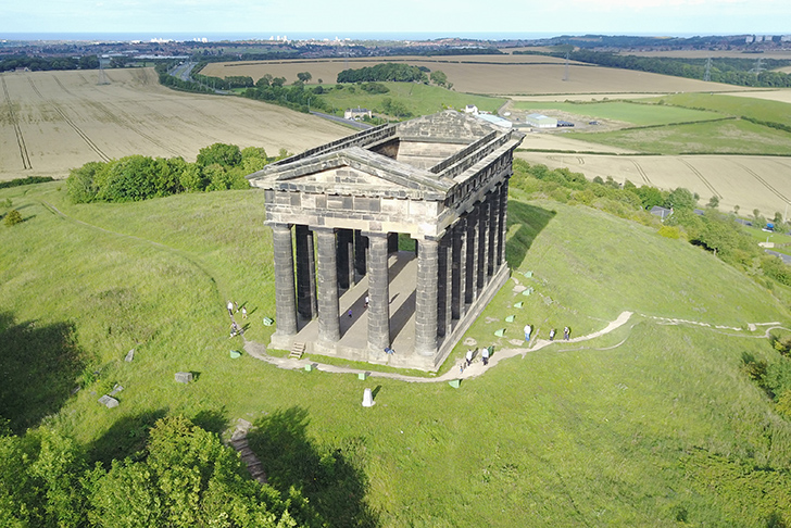 The Penshaw Momument in County Durham surrounded by grass