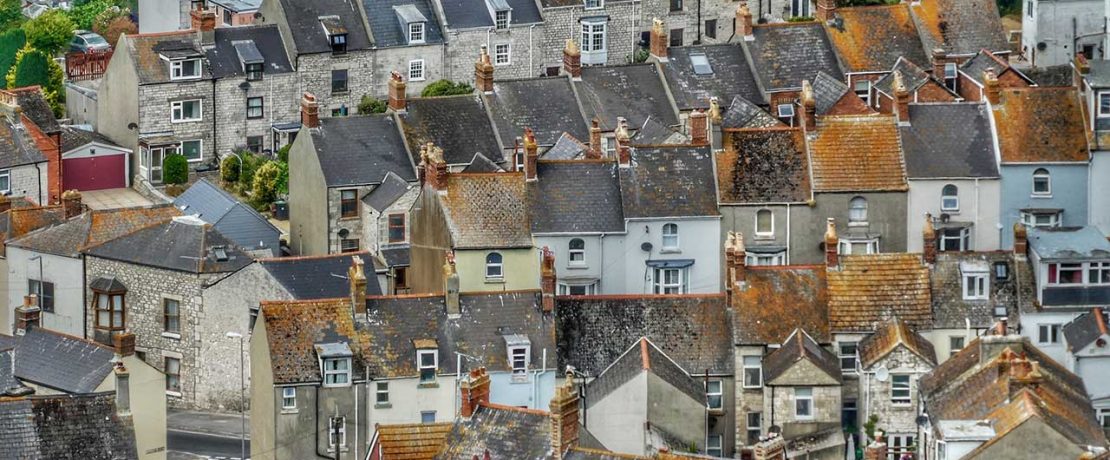 An array of rooftops in different shades of brown and grey