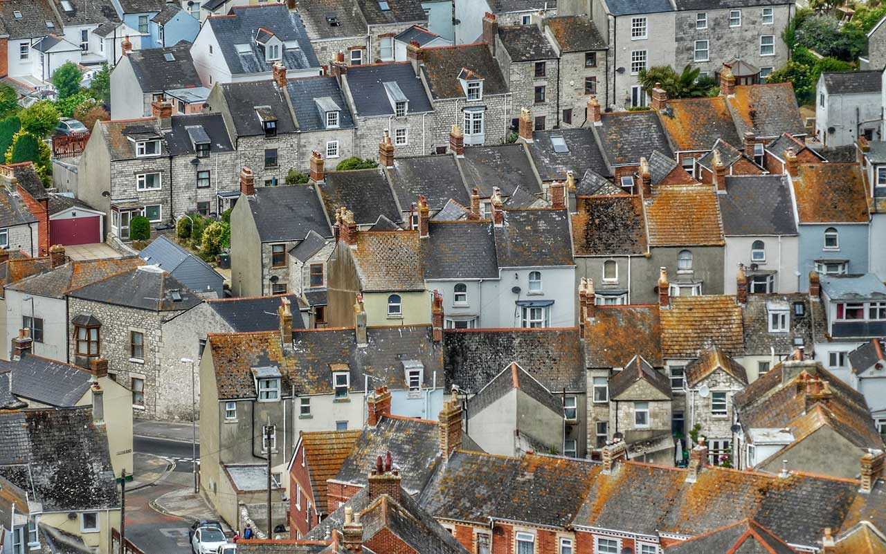 An array of rooftops in different shades of brown and grey