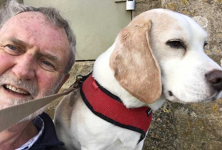 Man and dog in close-up selfie