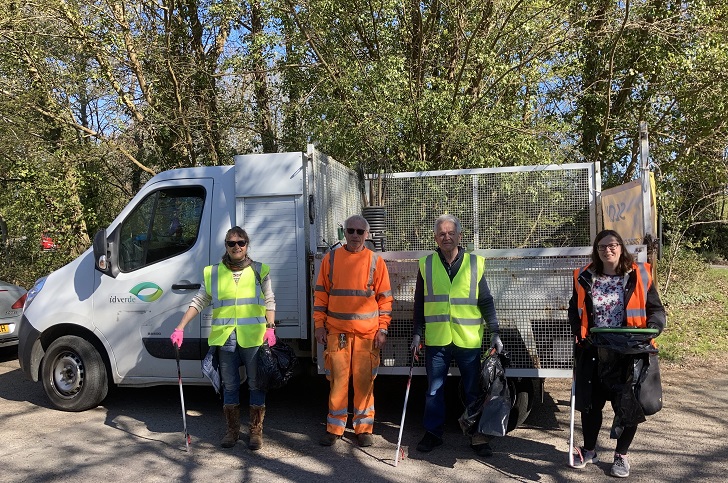Litter pickers posing in front of their support van