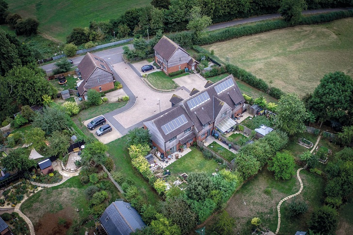 An aerial view of a small village housing development