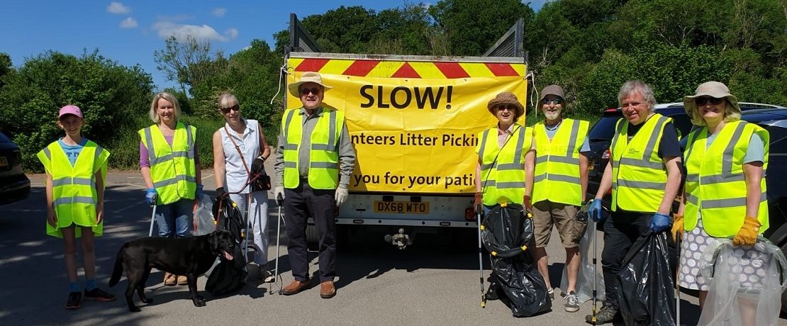 A group of litter pickers in hi-vis vests