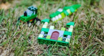 Green Lego building bricks in grass