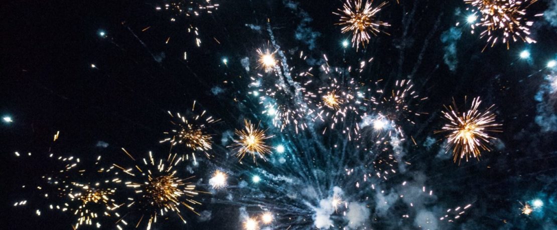 A photo of colourful fireworks against a dark sky