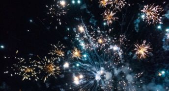 A photo of colourful fireworks against a dark sky