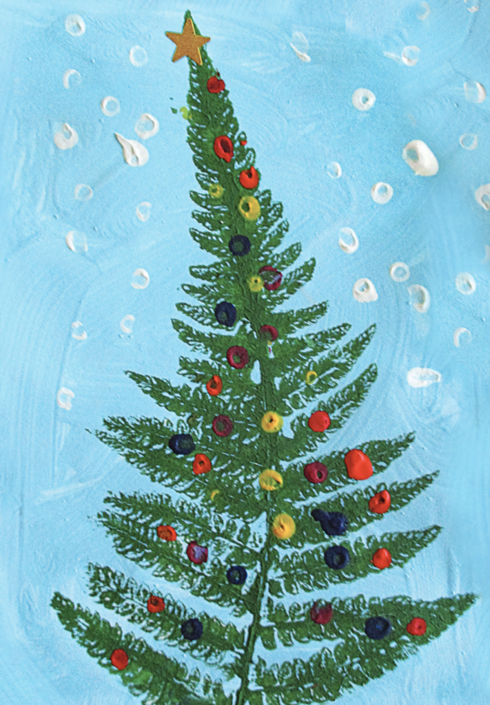 A green tree shape made by imprinting a fern in paint and pressing onto the page