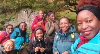 A group of women on a hill walk