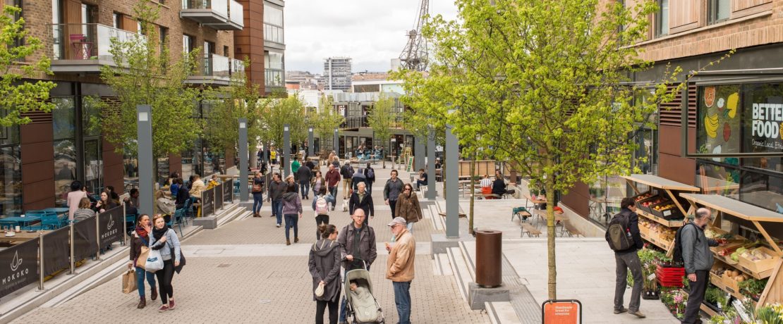 People chatting and shopping in an urban district