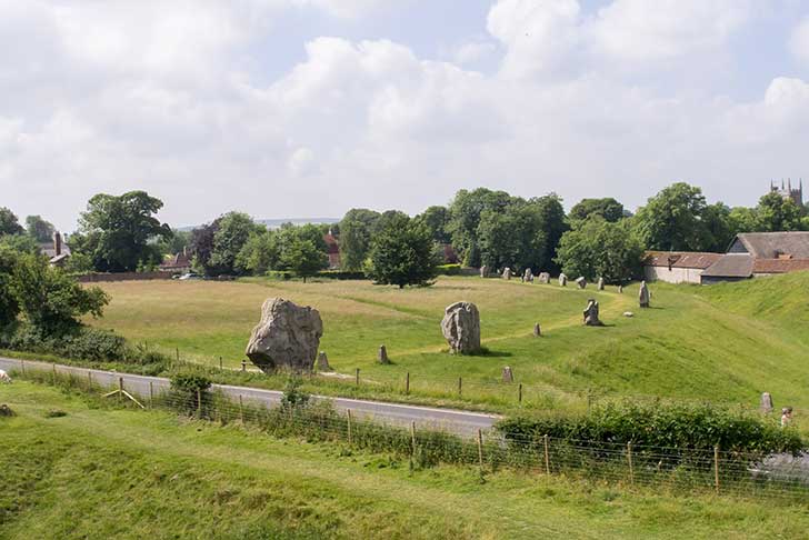 The end of a circle of large grey stones on a grassy field