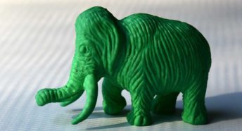 A green textured plastic toy elephant