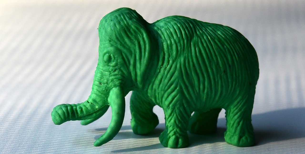 A green textured plastic toy elephant