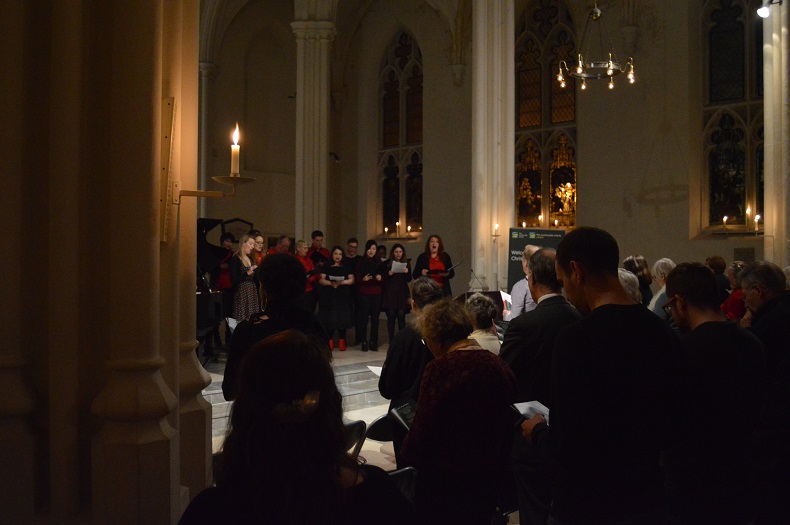 Soloist in front of choir at Christmas carol service