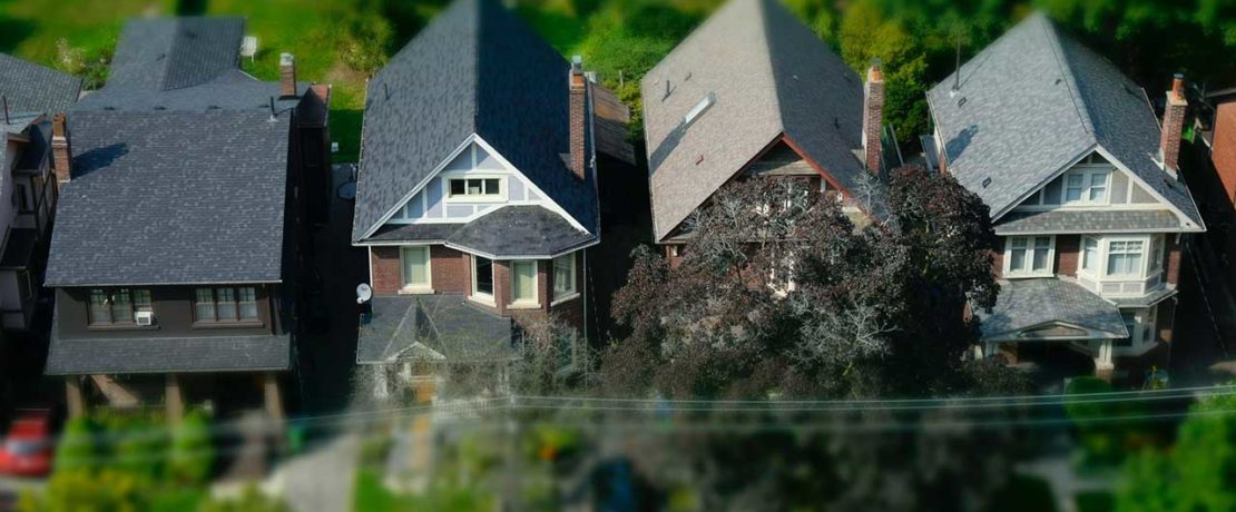 Houses as seen from above with a dramatic focus effect making some parts pin-sharp