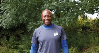 A black man in sportswear in the countryside